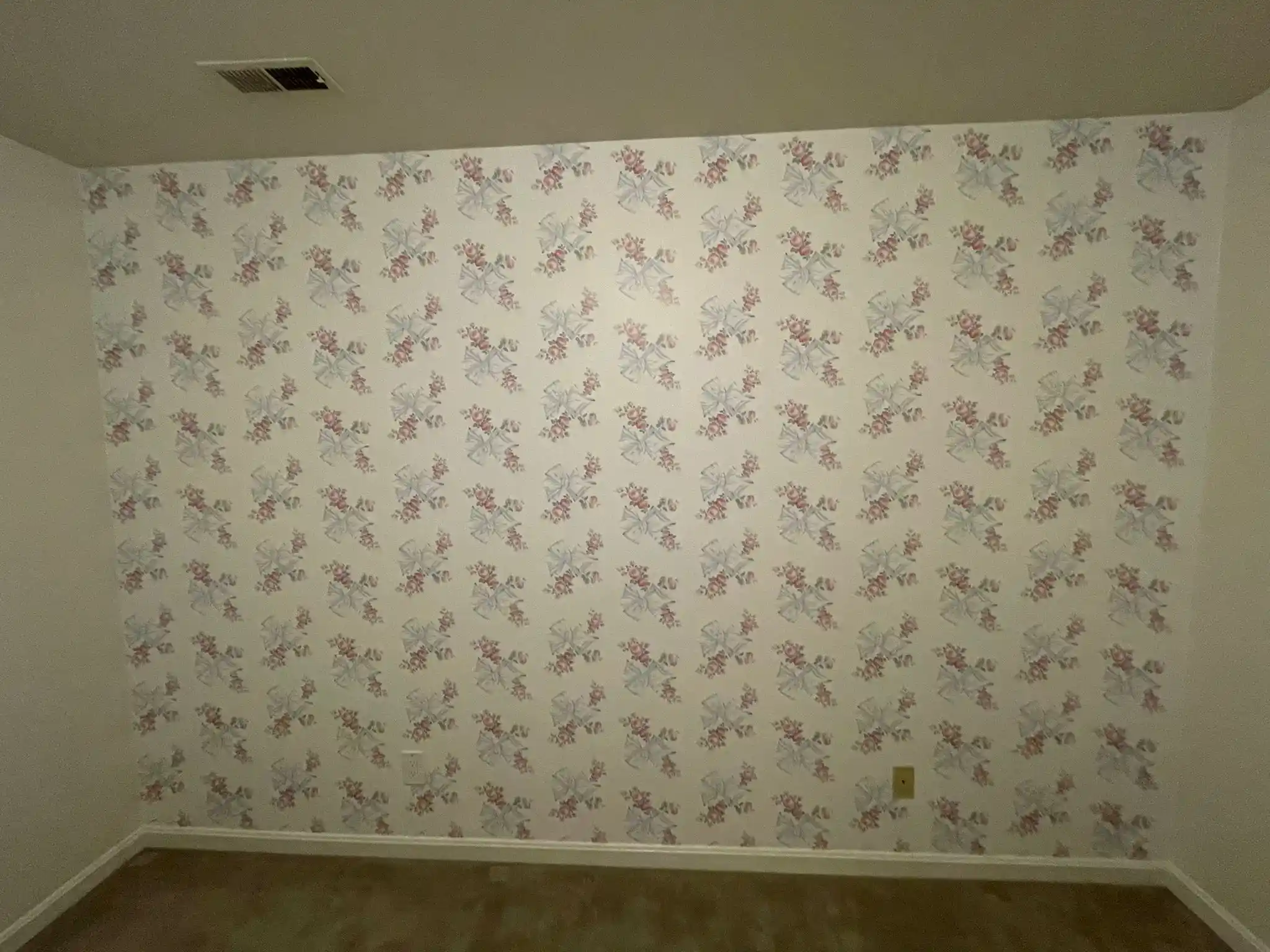 Light wallpaper with a small repeating botanical pattern